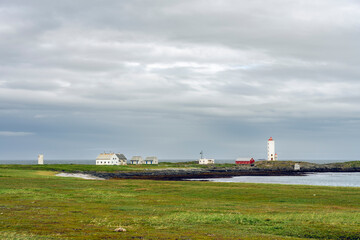 Fototapeta na wymiar The Kjolnes Lighthouse by the Barents Sea in the vicinity of Berlevag, Finnmark, Norway
