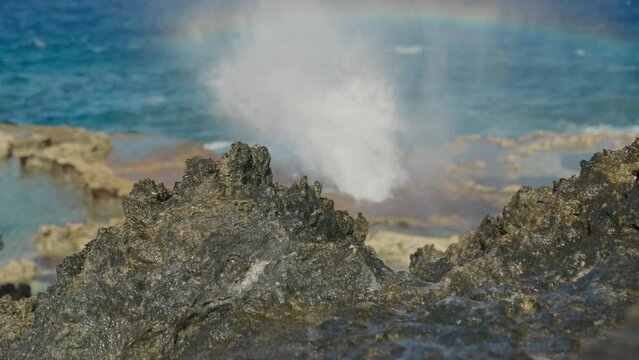 Small rainbow showing at blow hole in Tinian Island