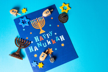 Religion concept of of jewish holiday Hanukkah with wooden dreidels (spinning top).