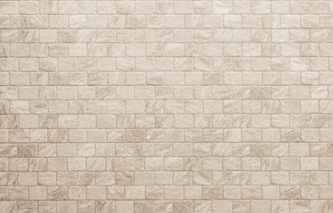 Empty background of wide cream brick wall texture. Beige old brown brick wall concrete or stone...