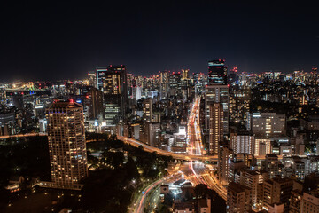 Fototapeta na wymiar Glimmering Tokyo: A Mesmerizing Nighttime Vista from Tokyo Tower's Illuminated Observation Deck