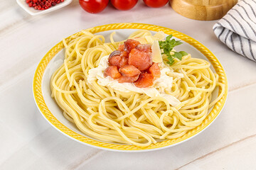 Pasta spaghetti with salmon and stracciatella