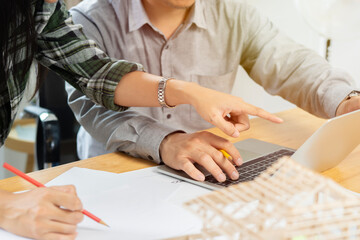 Two engineering or architecture discussing and working on blueprint with architect equipment