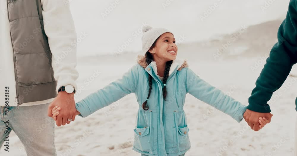 Wall mural Holding hands, family and girl child at the beach with parents for vacation, bond and fun together. Love, smile and face of kid with mother and father on an ocean trip, freedom and relax in nature