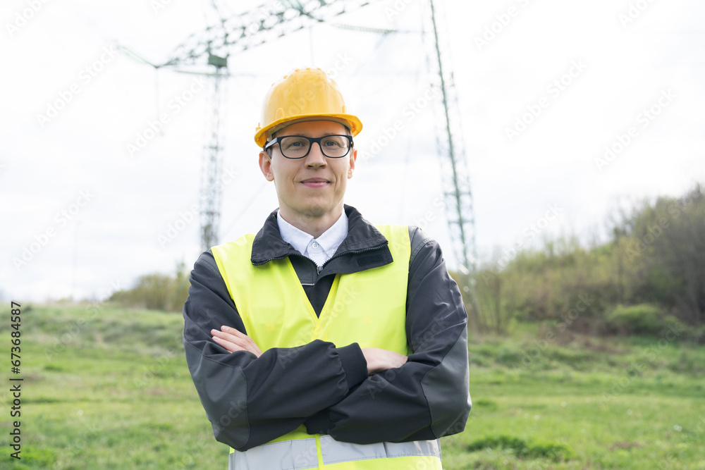 Aufkleber Engineer with digital tablet on a background of power line tower.