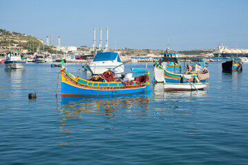 Fototapeta na wymiar Marsaxlokk harbor and boats