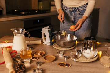 A close-up of the process of making New Year's gingerbread cookies in an atmospheric kitchen at home. Christmas mood