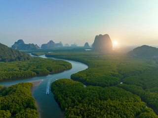 Aerial view green mangrove forest and river flowing at Phang Nga Bay with mountains in Thailand.