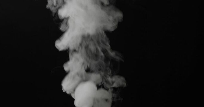 Realistic atmospheric gray smoke on black background.
