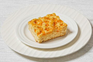 peach cake on white plate, top view