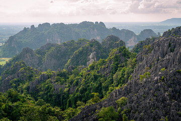 Fototapeta premium A viewpoint in top of limestone mountains over the city in Phitsanulok province, Thailand