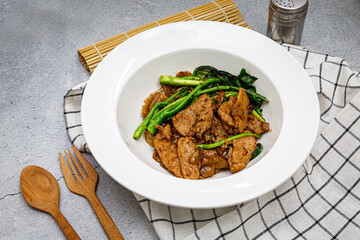 Stir-fried large noodles with black soy sauce and pork and kale - Asian food style