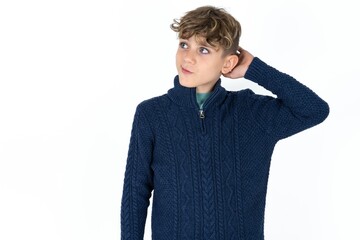 Caucasian teen boy confuse and wonder about question. Uncertain with doubt, thinking with hand on head. Pensive concept.