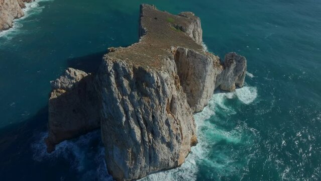 Flying in orbit over Pan di Zucchero on the island of Sardinia, near Masua.