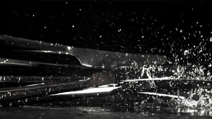 The knife falls on the black table. Filmed on a high-speed camera at 1000 fps. High quality FullHD footage