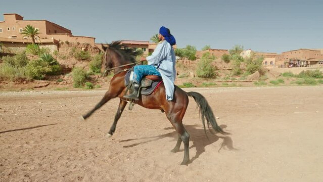 Man rearing his horse, slow motion, Morocco