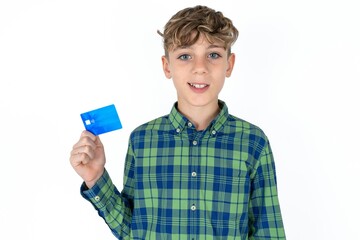 Photo of happy cheerful smiling positive caucasian kid boy wearing plaid shirt recommend credit card