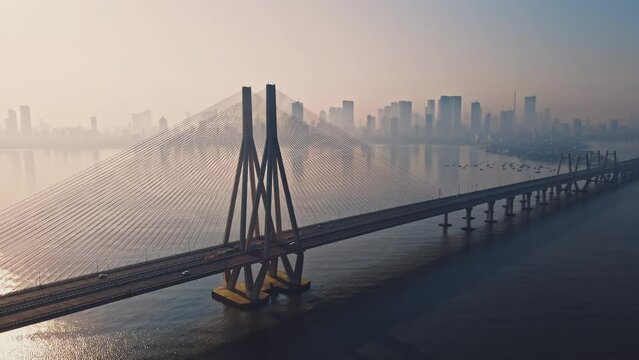 Cinematic aerial view of traffic passing over Bandra Worli Sea Link in Mumbai, India in the morning. Sunrise View of the sea bridge 