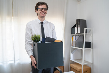 lay off workers. Banner size closes up hands of usinessman holding box of stuff to leave office after fired from work.