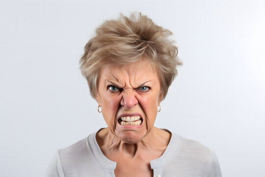 Angry senior Caucasian woman yelling, head and shoulders portrait on white background. Neural network generated image. Not based on any actual person or scene.
