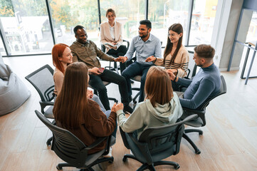 Group of people are having therapy meeting together