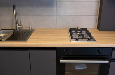 mock up gas stove in the minimal style kitchen with white and grey color in modern house. 