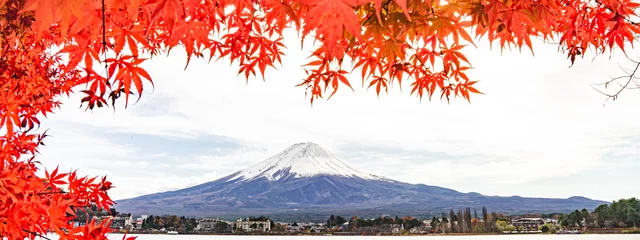 Foto auf Acrylglas Fuji a colorful of maple red leaf in autumn with the fuji mountain and cloudy sky at the Kawaguchiko Lake in Japan, landscape photo of fuji mountain the landmark of japan.