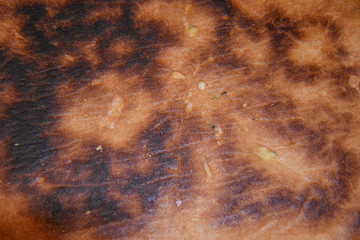 Burned bread crust texture. Overcooked bread crust close-up - obrazy, fototapety, plakaty