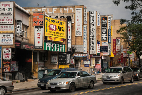 Street covered by Oriental signs in Flushing neighborhood, Queens, New York 