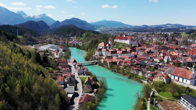 Aerial view of Fuessen with a view of the Lech river, the Benedictine monastery of St. Mang and the high castle. Ostallgaeu Swabia, Bavaria, Germany, Europe