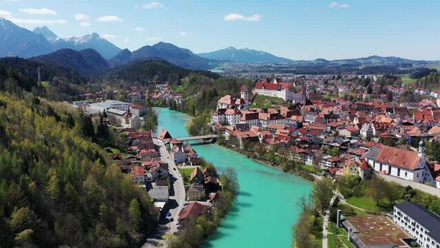 Aerial view of Fuessen with a view of the Lech river, the Benedictine monastery of St. Mang and the high castle. Ostallgaeu Swabia, Bavaria, Germany, Europe