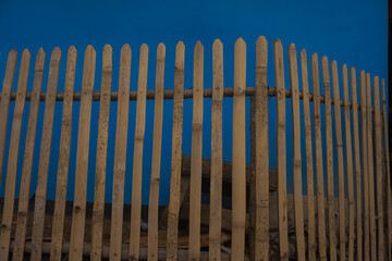 Traditional or ancient house fence made from dry golden bamboo 