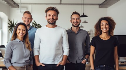 Diverse creative team looking happy. Diverse working culture group of persons is in their startup office wearing informal clothes people are smiling most persons are standing. - obrazy, fototapety, plakaty