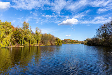 Fototapeta premium Autumn landscape near the lake on a sunny day