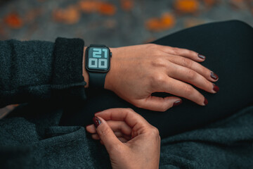 Smart watch. Smart watch on a woman hand outdoor. Woman hand touching a smart watch