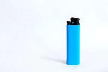 Blue plastic lighter on white background