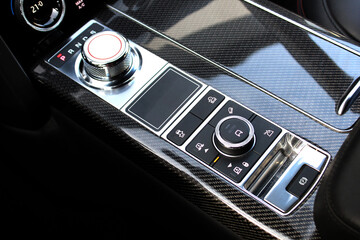 Automatic transmission gearshift stick, SUV air suspension control. Closeup a manual shift of...