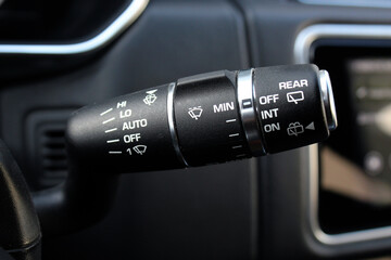 Close up Wipers switch control premium car. Adjusting speed of screen wipers in lux car. Wiper...