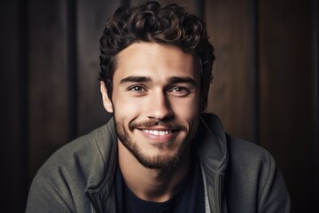 Fototapeta premium Casual Portrait Of Smiling Young Man. Сoncept Stunning Sunset Silhouettes, Urban Landscape Photography, Dramatic Black And White Portraits, Candid Family Photos, Elegant Wedding Moments