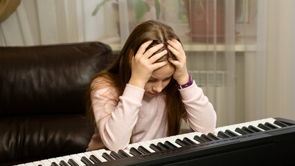Frustrated Young Pianist at Home © Vagengeim