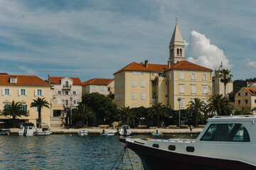 Fototapeta premium Amazing view of yacht marina and old town Supetar, Brah island, Croatia. Beautiful sunny day.