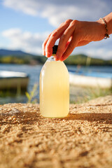 bottle of refreshing and probiotic drink. Homemade Kombucha with lemon, liquid medicine with vitamins. Copy space