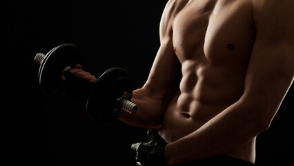 Muscular young man lifting weights