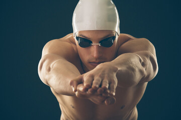 Professional male swimmer preparing for jump
