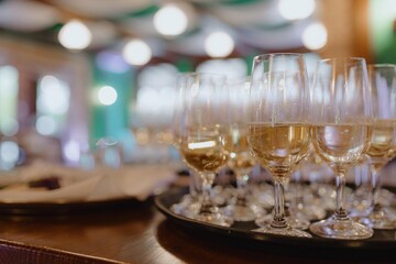 Alcoholic beverages. Elegant decoration of wedding event with glasses with champagne, white wine. 
