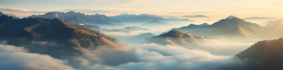 A Majestic Mountain Range Shrouded in Mystical Clouds - obrazy, fototapety, plakaty