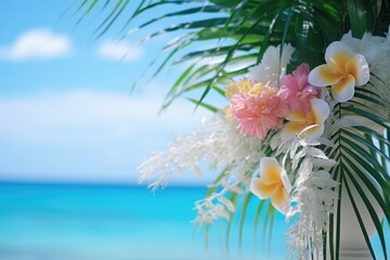 Close-up view of flower palm tree leaf decoration for a wedding at beach with blue sea. Summer tropical vacation concept.