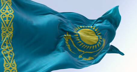 Close-up of Kazakhstan national flag waving on a clear day