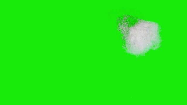 A piece of sintepon or cotton wool wipes the surface on a green chromakey background. Stop motion animation