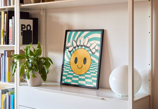 Mockup of customizable vertical wooden picture frame on shelf